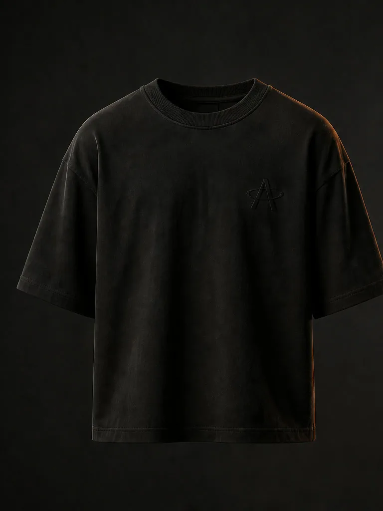 Front of the Black Soil oversized tee: a small tonal Magnetic A at the left chest.