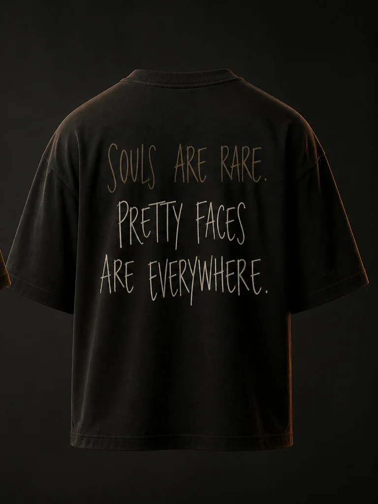 Back of the tee, hand-lettered in bone and oxide: Souls are rare. Pretty faces are everywhere.
