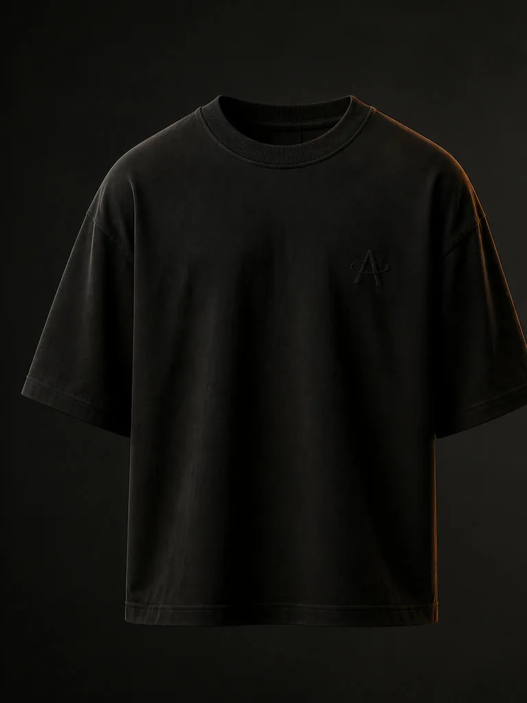 Front of the Black Soil oversized tee: a small tonal Magnetic A at the left chest.